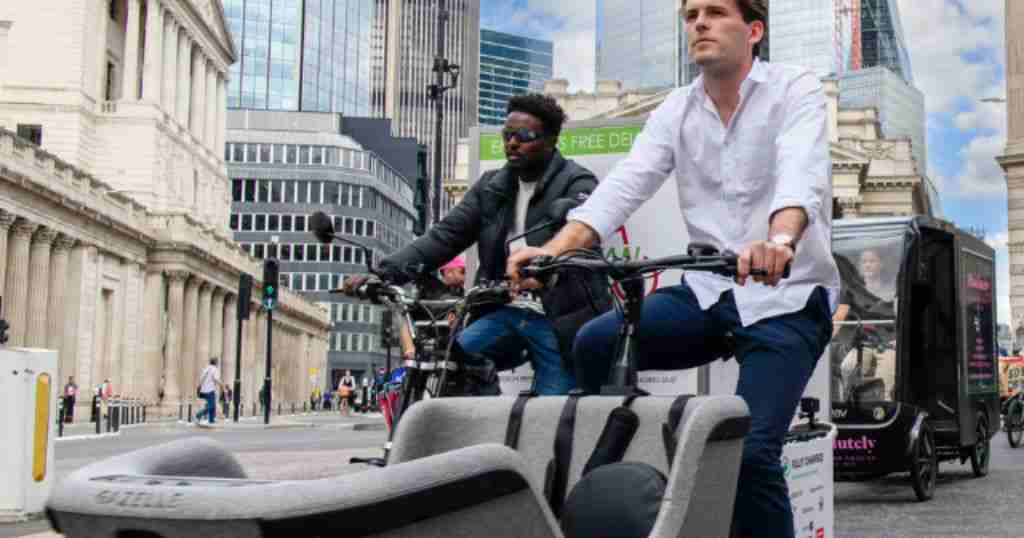 Cargo bikes cycling in Bank, London.
