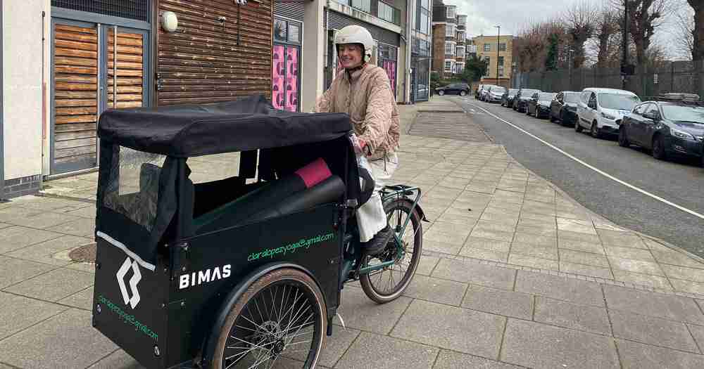 Woman in a helmet on a cargo bicycle