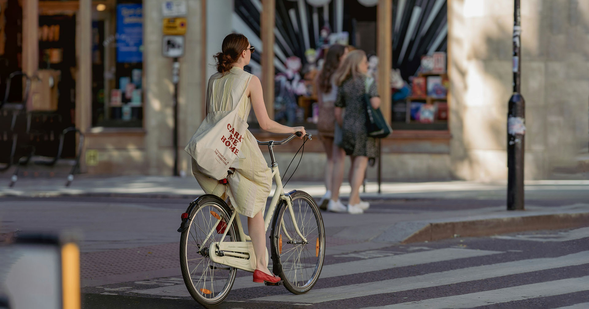 A woman riding a bicycle in a city s treet